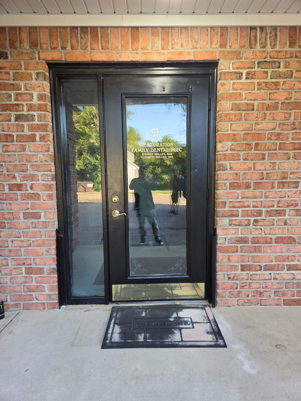 New commercial entrance door fitted in a brick elevation