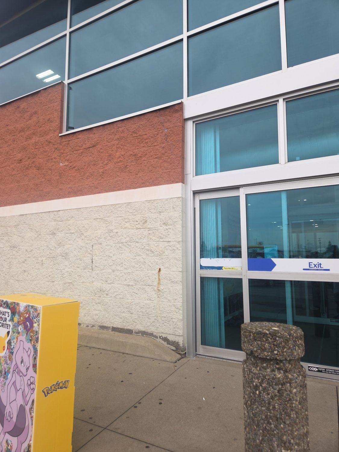 Commercial storefront exterior with glazing and a brick surround
