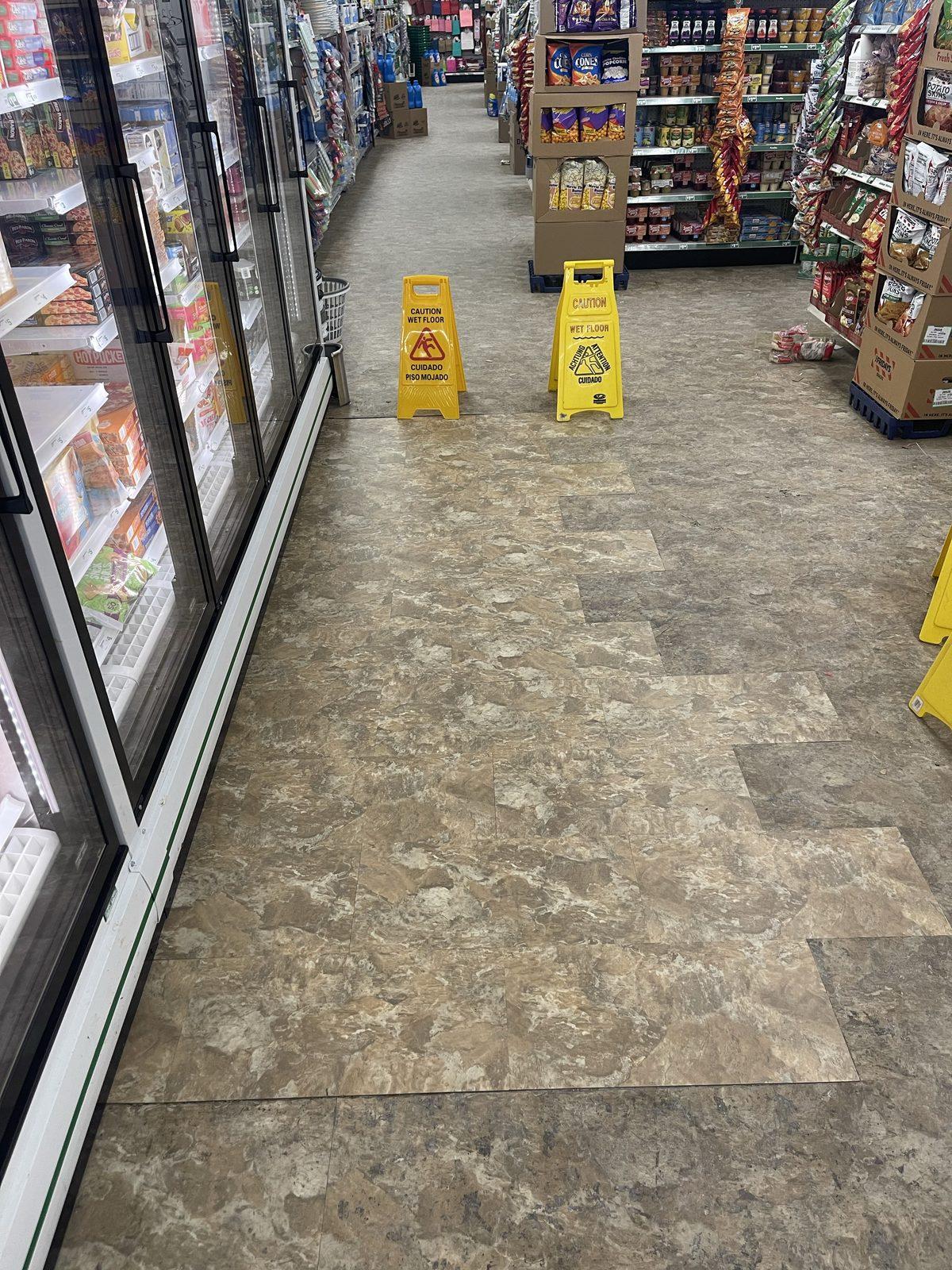 The same shop aisle with the new floor laid and the aisle back in use